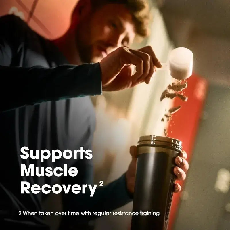 Man pouring energy supplements into a shaker, promoting muscle recovery after resistance training.